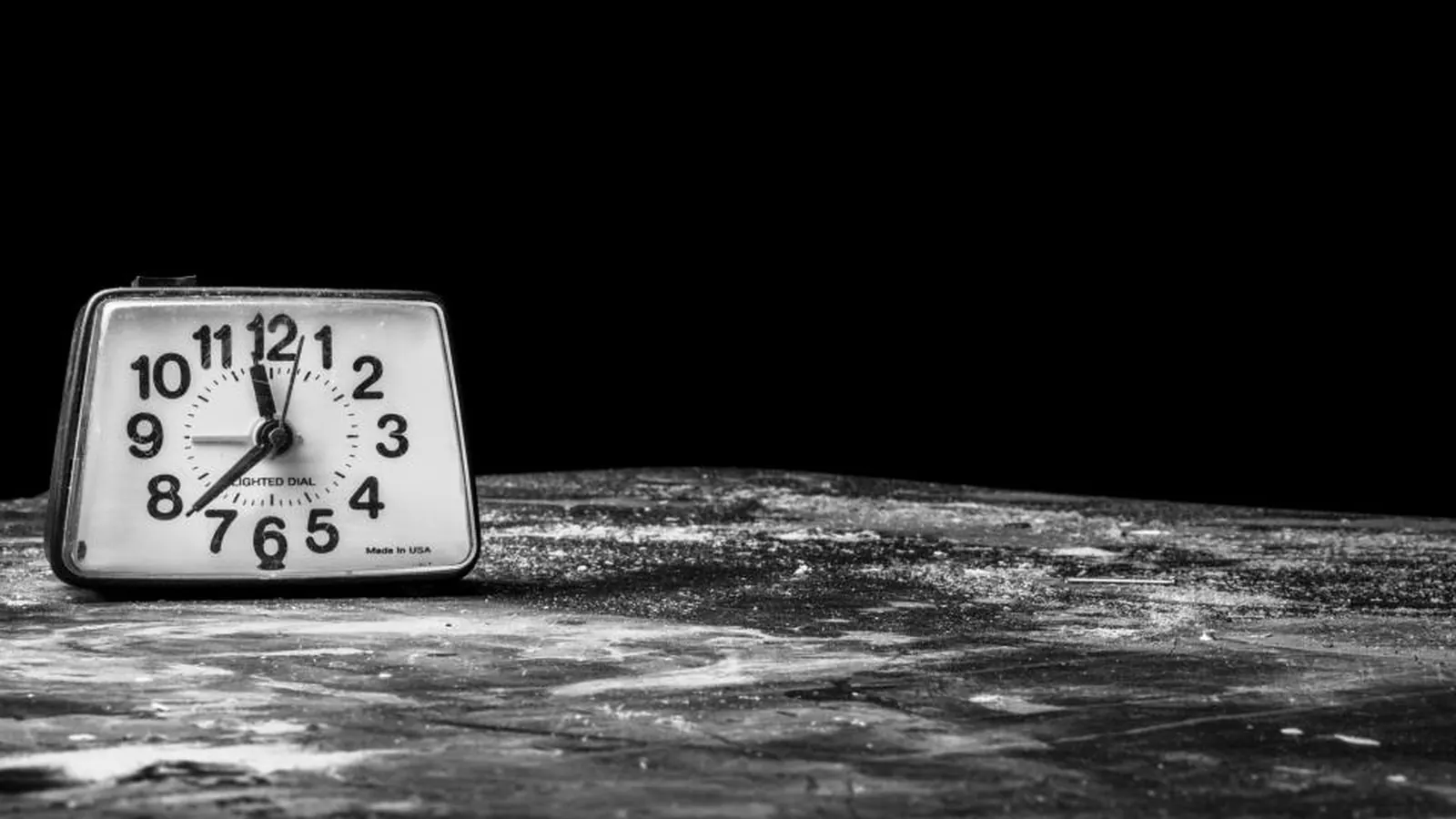 Alarm clock on a dark surface