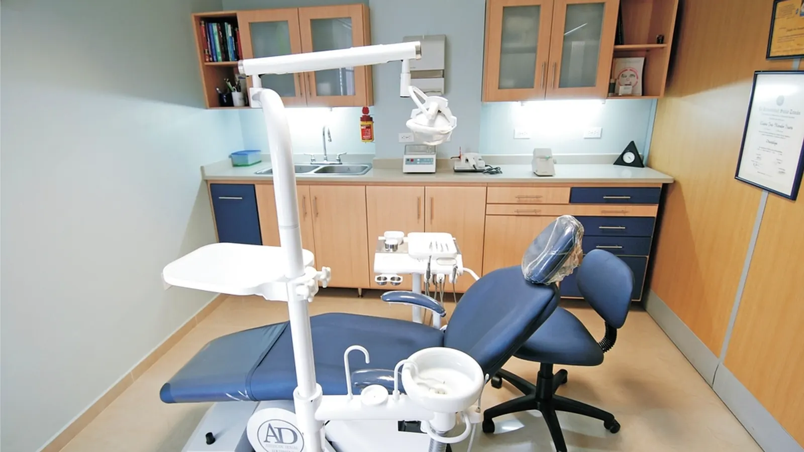 Empty dental treatment room with a patient chair