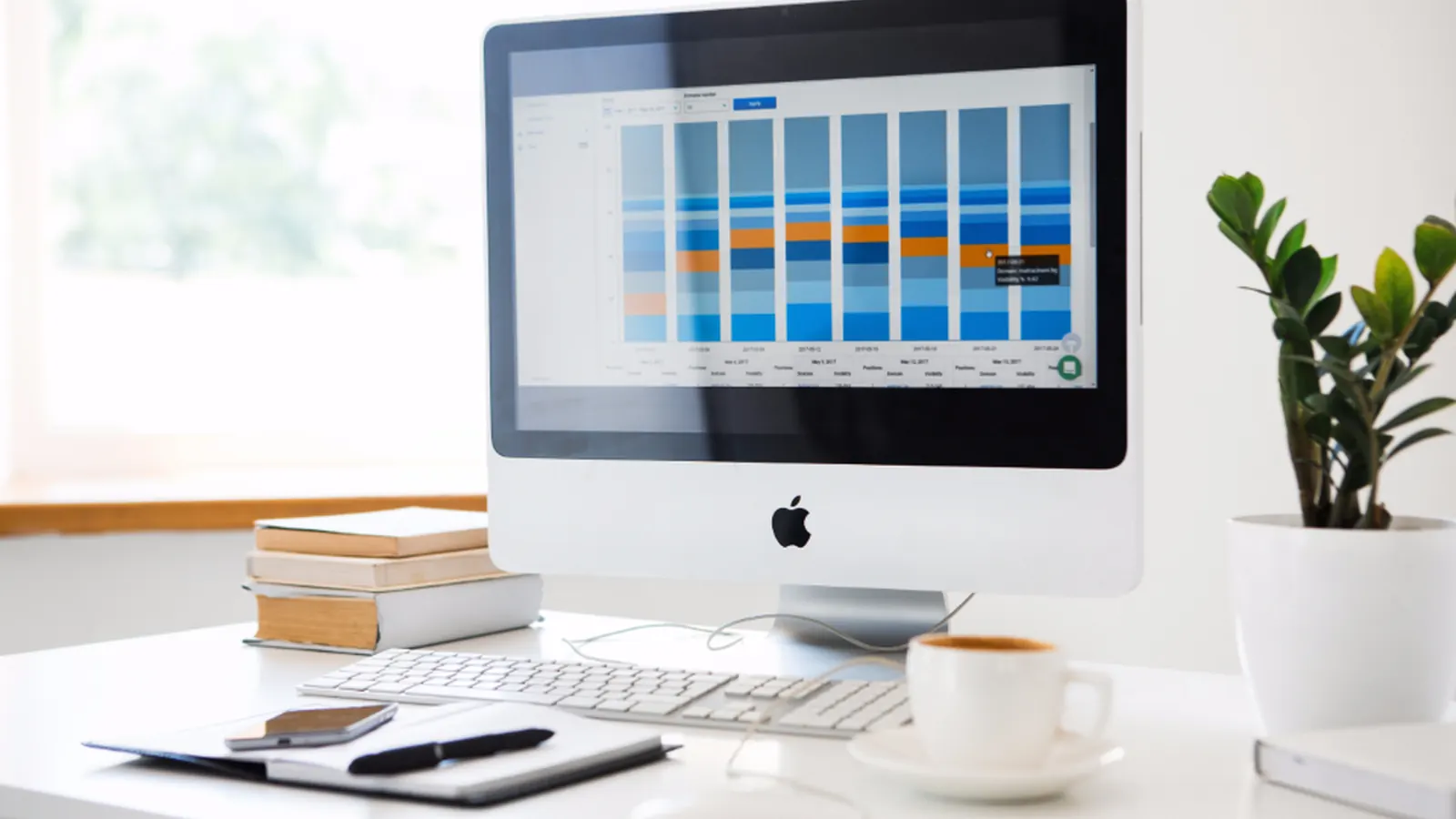 Desktop computer displaying a data dashboard