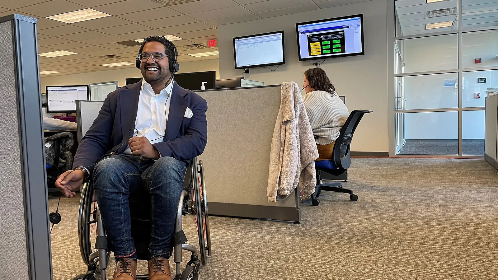 Call center agent wearing a headset in a modern contact center