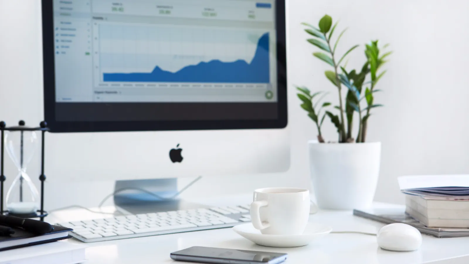 Monitor with a performance dashboard on a white desk