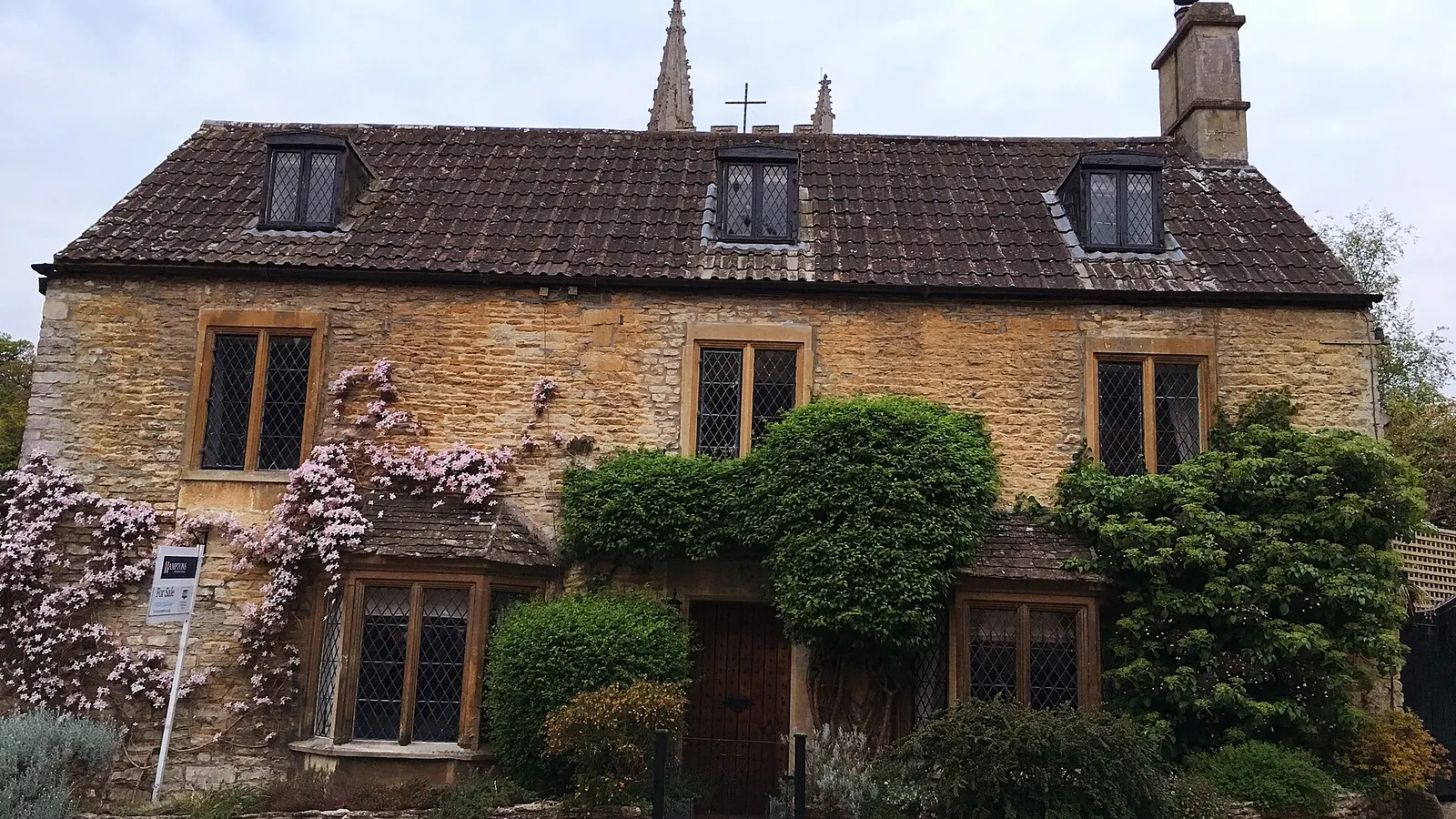 Stone country house with a garden in front