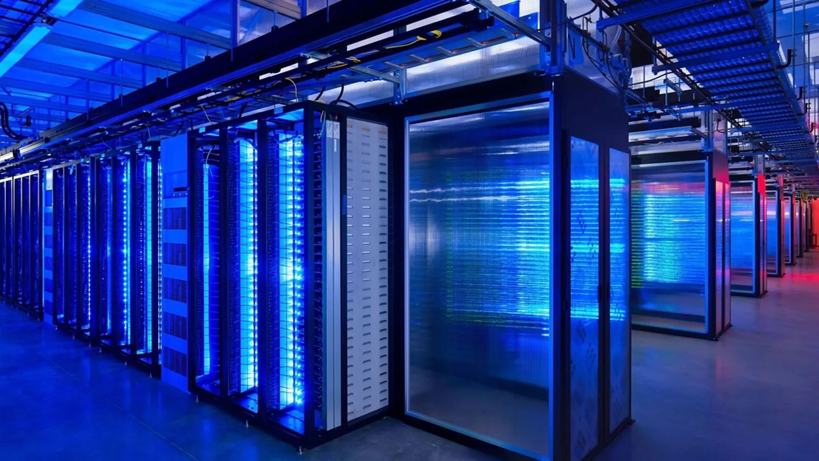 Data center with rows of illuminated server racks